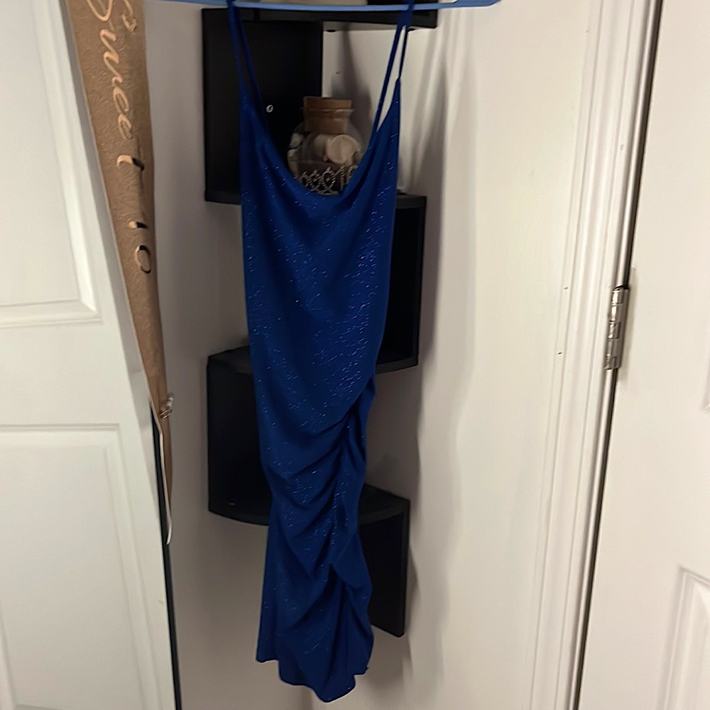 short Skin tight Sabora dress its blue with sparkles on it and its a size medium